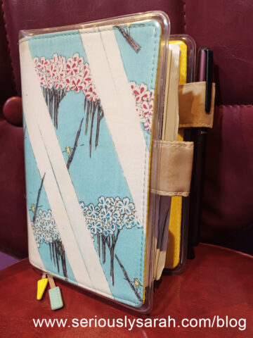 Hobonichi journal with pen in the pen slot of the cover